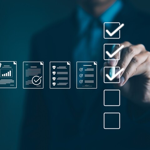 A person selects digital checkboxes next to stylized document icons on a virtual interface. The image represents quality management, compliance, and digital inspection processes.
